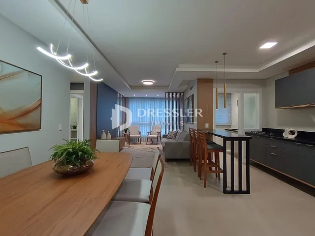 Sala de estar e jantar de um apartamento moderno em Lajeado.