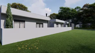 Foto da fachada de uma casa moderna com jardim em Lajeado, Brasil.