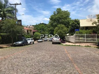 Vista externa de uma propriedade em Lajeado, Brasil, mostrando a entrada pavimentada.