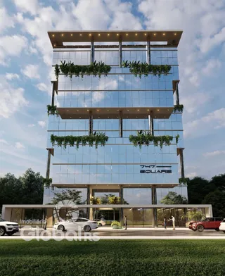 Fachada de um prédio comercial moderno com fachada de vidro.