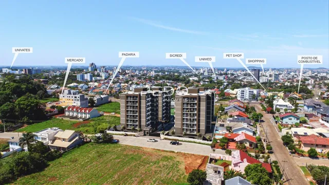 Vista aérea de uma área residencial em Lajeado, Brasil, mostrando diversas propriedades e terrenos.