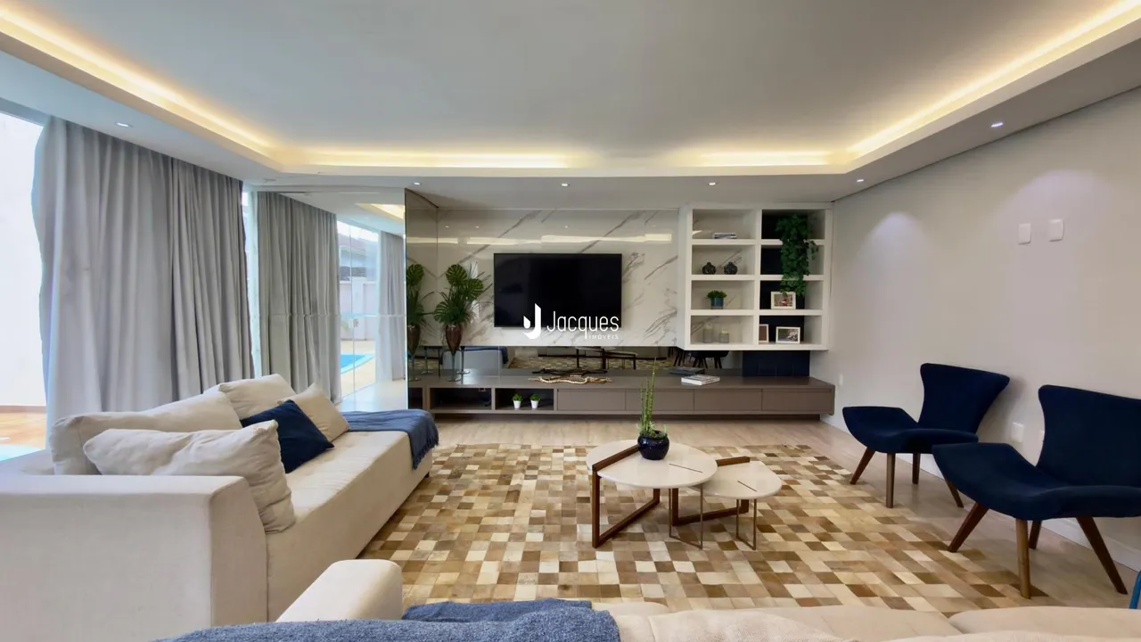 Sala de estar moderna com piso em ladrilhos e decoração contemporânea.