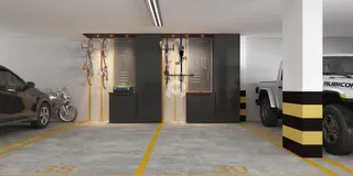 Vista interna de uma garagem com veículos estacionados.