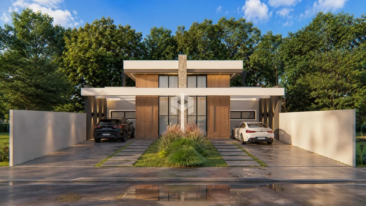 Fachada de uma casa moderna em Lajeado com jardim.