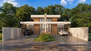 Fachada de uma casa moderna em Lajeado com jardim.