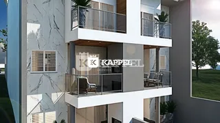 Fachada moderna de um edifício residencial em Lajeado, Brasil, com varandas de vidro.