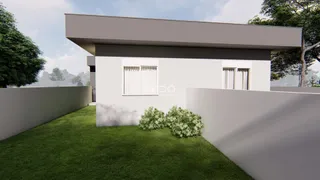 Fachada moderna de uma casa com jardim gramado em Lajeado, Brasil.
