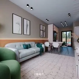 Sala de estar com sofá e carpete claro em um imóvel.