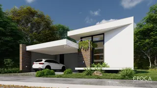 Fachada moderna de uma casa em Lajeado, Brasil, com garagem e paisagismo.