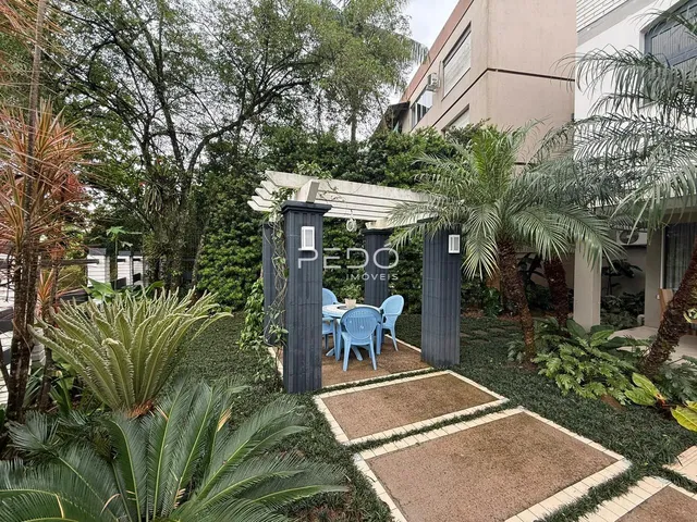 Área externa com jardim e paisagismo em Lajeado.