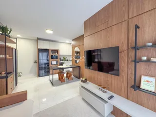 Ambiente moderno de sala de estar e cozinha em um imóvel no Brasil.