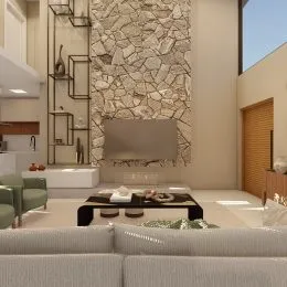 Sala de estar com sofá e lareira de pedra em ambiente interno.