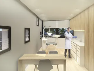 Foto de um banheiro moderno com bancada e louças brancas.
