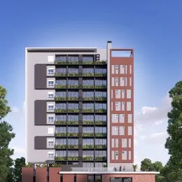 Fachada de um prédio residencial em Lajeado, Brasil, com varandas verdes.