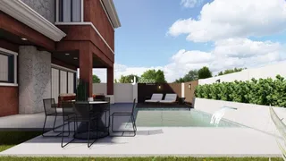 Fachada moderna de uma residência com piscina e área externa.