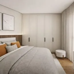 Quarto com cama e armários brancos em um ambiente claro.