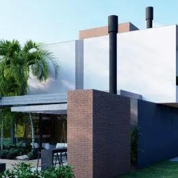 Fachada externa de uma residência moderna com detalhes em tijolo e vegetação.