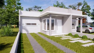 Fachada externa de uma residência moderna com garagem e jardim em Lajeado.