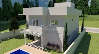 Fachada de uma casa branca em Lajeado, Brasil, com jardim frontal.