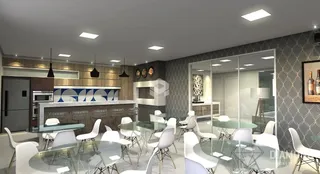 Vista de uma sala de jantar moderna com mesa de vidro e cadeiras brancas.
