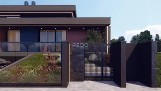 Fachada de uma residência moderna com portão de ferro em Lajeado.