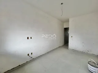 Hall de propriedade em Lajeado com paredes brancas e piso claro.