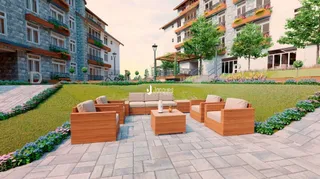 Fachada de um prédio residencial em Lajeado, Brasil, com jardim e pátio.