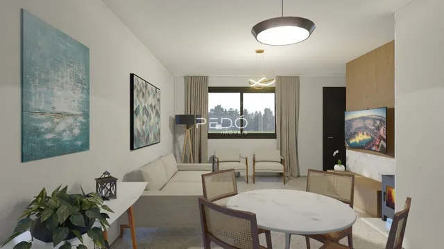 Sala de estar com sofá e mesa de jantar em um imóvel no Brasil.