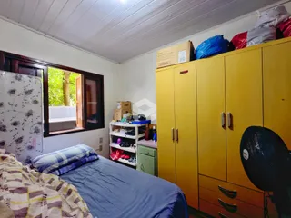 Foto do interior de um quarto em uma propriedade em Lajeado, Brasil.
