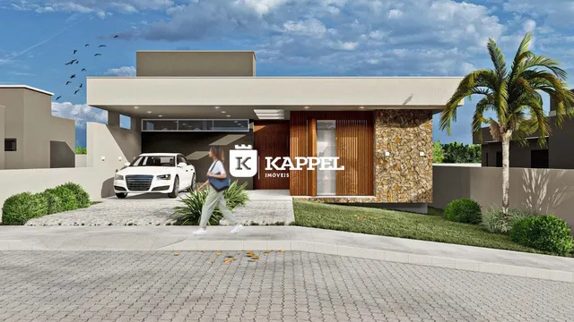 Fachada moderna de uma residência em Lajeado, Brasil, com paisagismo e palmeira.