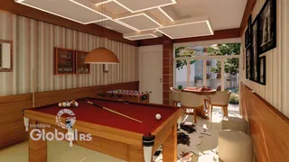 A sala apresenta uma mesa de bilhar de madeira.