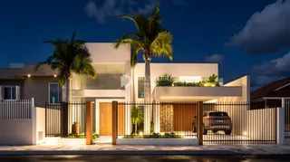 Fachada moderna de uma residência em Lajeado, Brasil, com cerca de ferro.