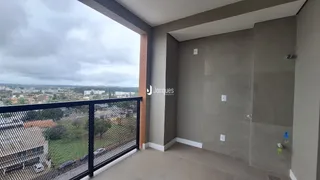 Vista da varanda com grade de segurança em Lajeado, Brasil.