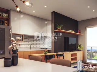 Ambiente moderno de sala de estar e cozinha em um imóvel.