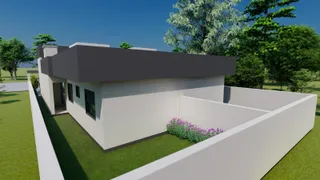 Fachada de uma casa moderna com muro branco e jardim verde.