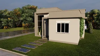 Fachada de uma casa moderna com paisagismo verde.