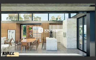 Ambiente moderno com sala de jantar e cozinha em um apartamento com acabamentos em madeira e mármore.