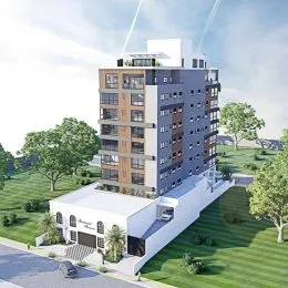 Fachada moderna de um prédio residencial em Lajeado, Brasil com área verde ao redor.