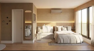 Quarto com cama grande e cabeceira em um ambiente bem iluminado.