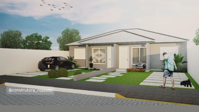 Fachada de uma casa em Lajeado, Brasil, com jardim e garagem.