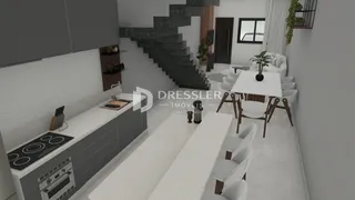 Ambiente de sala de jantar e cozinha em um imóvel no Brasil.