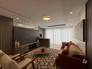 Sala de estar moderna com sofá e decoração em tons neutros.