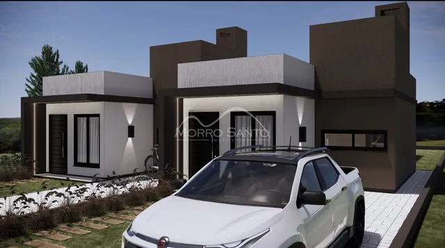 Fachada moderna de uma residência em Lajeado, Brasil, com paisagismo frontal.