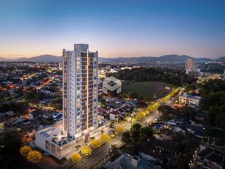 Vista aérea de um edifício residencial alto em Lajeado, Brasil, ao entardecer.