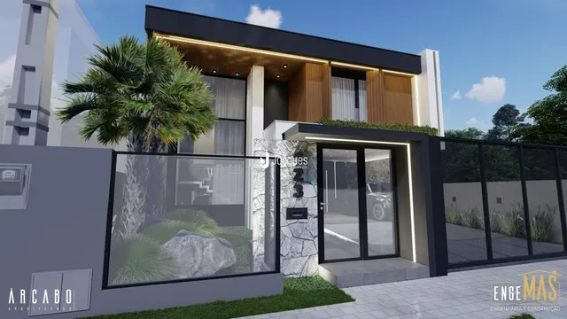 Fachada moderna de uma residência em Lajeado, Brasil, com grandes portas de vidro e paisagismo.