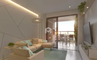 Sala de estar moderna com sofá e vista para a cidade.
