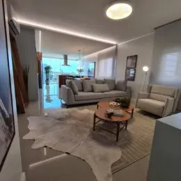 Sala de estar com sofá e piso claro em um apartamento.