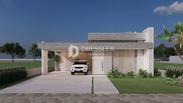 Fachada moderna de uma casa em Lajeado, Brasil, com entrada coberta e jardim.