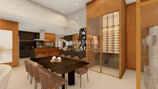 Interior de uma sala de jantar e cozinha moderna em um imóvel no Brasil.