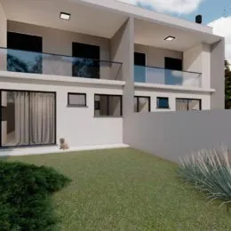 Fachada de uma casa moderna com gramado verde no primeiro plano em Lajeado.